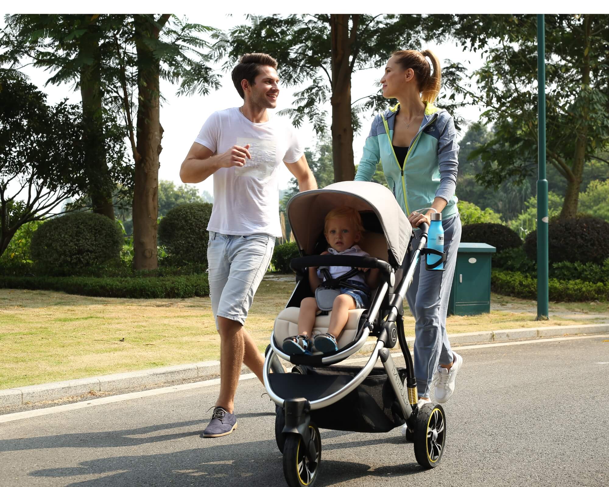 Three Wheels Baby Stroller Baby Pram with a couple and kid Three Wheels Baby Stroller Baby Pram with a couple and kid