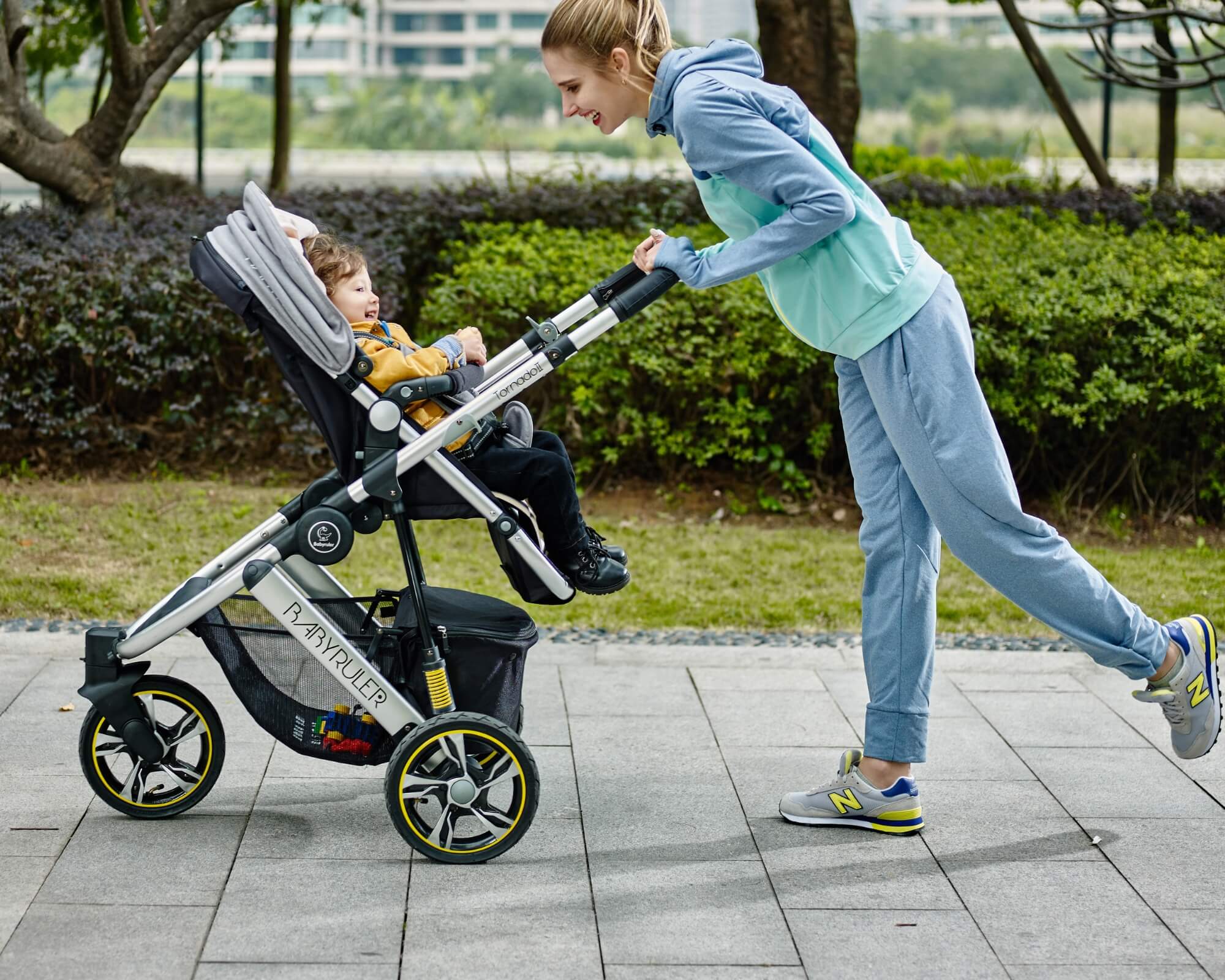 Three Wheels Baby Stroller Baby Pram with mum and a child