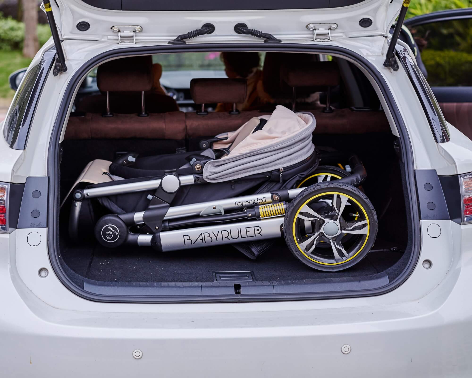 Three Wheels Baby Stroller Baby Pram folded in a car